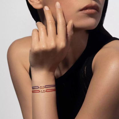 Move Uno red cord bracelet
